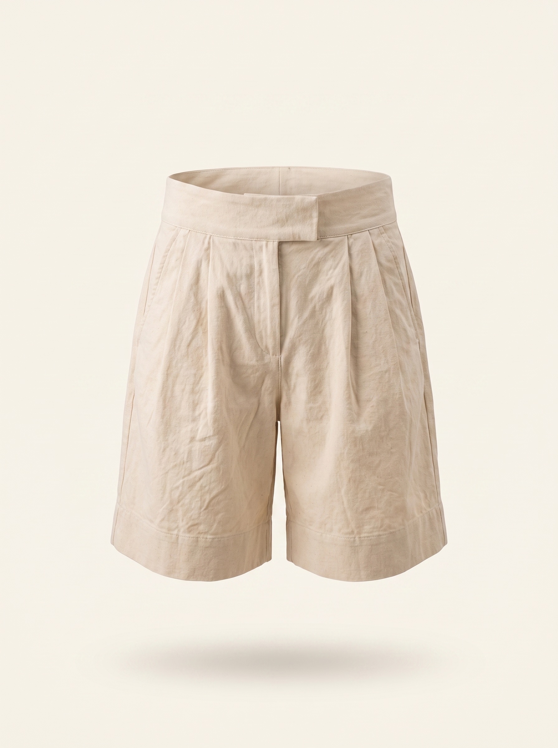 The Pleated Shorts, front, on cream